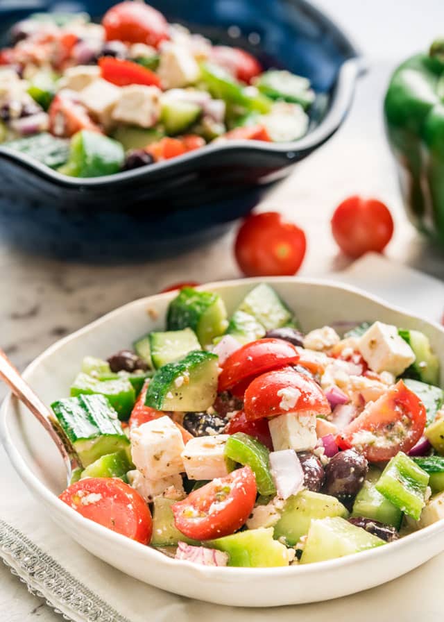 side view shot of a bowl full of greek salad