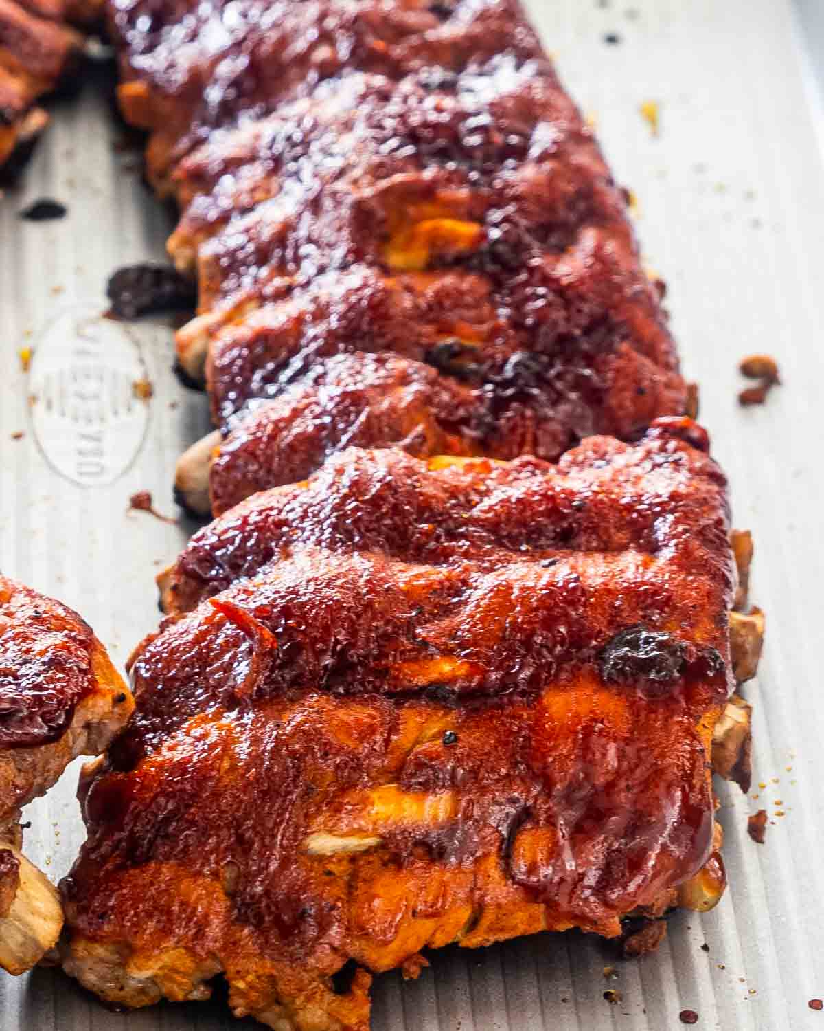 bbq ribs on a baking sheet.
