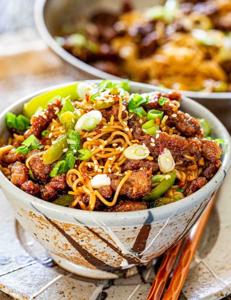 a serving of mongolian beef noodles in a bowl.