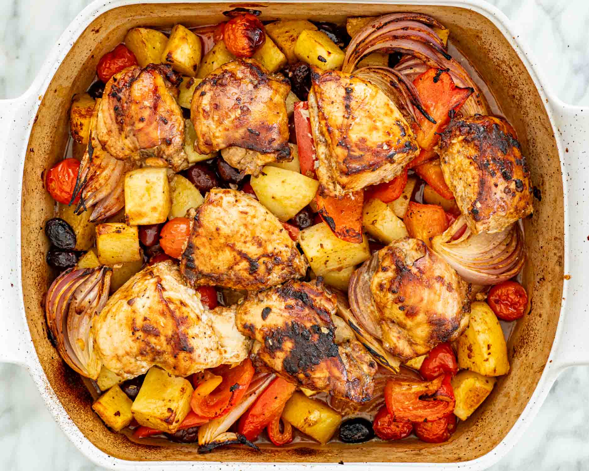 process shots showing how to make roasted chicken and vegetables.